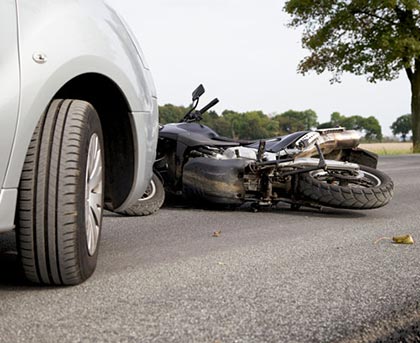 Car accident with motorcycle in street