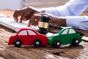 Rideshare-Accident-Lawyer-Altamonte-Springs-FL-two-toy-cars-crashed-on-table.